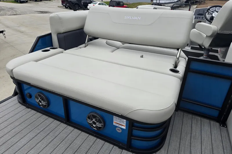 Slide: The Image of 2024 Sylvan Mirage X X5 CLZ boat with comfortable seating and integrated speakers. - 21