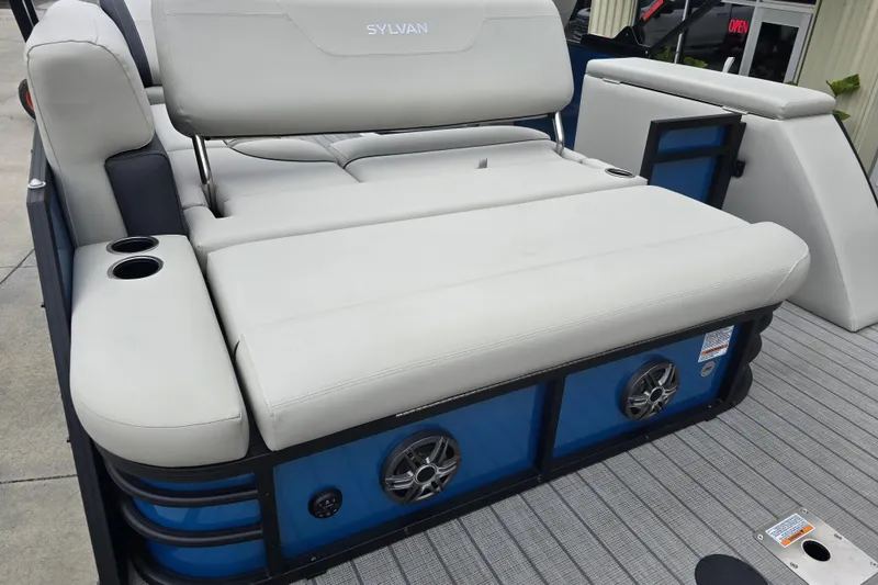 Slide: The Image of 2024 Sylvan Mirage X X5 CLZ boat with comfortable seating and built-in speakers. - 22