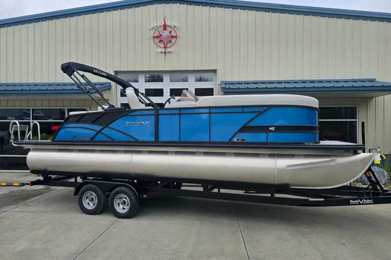 Slide: The Image of 2024 Sylvan Mirage X X5 CLZ pontoon boat on trailer outside Lake Viking Marine. - 6