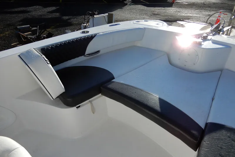 Slide: The Image of 2022 Twin Vee 240 CC GFX Limited Edition boat interior with cushioned seating. - 10