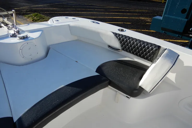 Slide: The Image of 2022 Twin Vee 240 CC GFX Limited Edition boat interior with cushioned seating. - 11