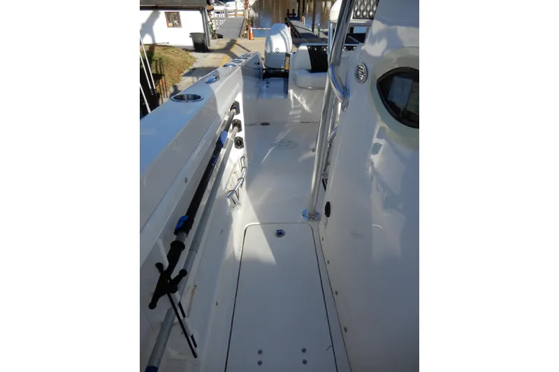 Slide: The Image of 2022 Twin Vee 240 CC GFX Limited Edition boat interior with fishing rod holders. - 13