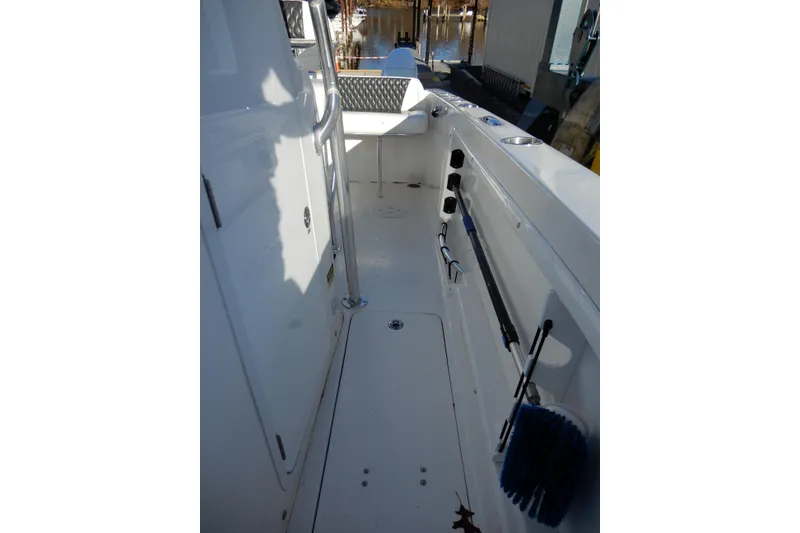 Slide: The Image of 2022 Twin Vee 240 CC GFX Limited Edition boat interior with storage and equipment. - 14