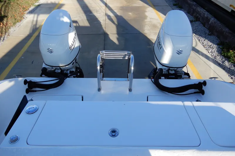 Slide: The Image of 2022 Twin Vee 240 CC GFX Limited Edition boat with dual Suzuki outboard engines. - 15