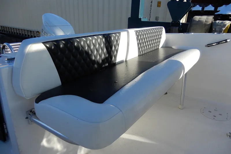 Slide: The Image of 2022 Twin Vee 240 CC GFX Limited Edition boat seat with quilted black and white upholstery. - 16