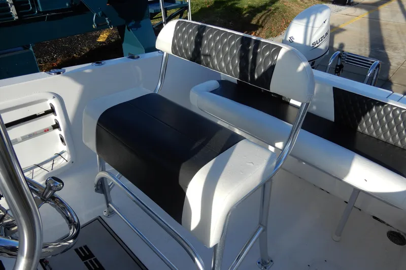 Slide: The Image of 2022 Twin Vee 240 CC GFX Limited Edition boat seating with sleek black and white design. - 18