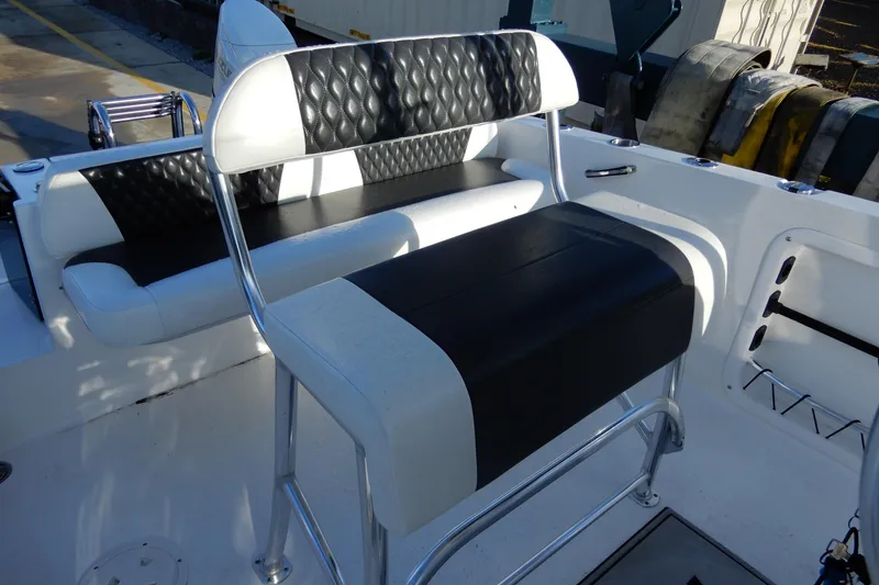 Slide: The Image of 2022 Twin Vee 240 CC GFX Limited Edition boat seating with black and white upholstery. - 19