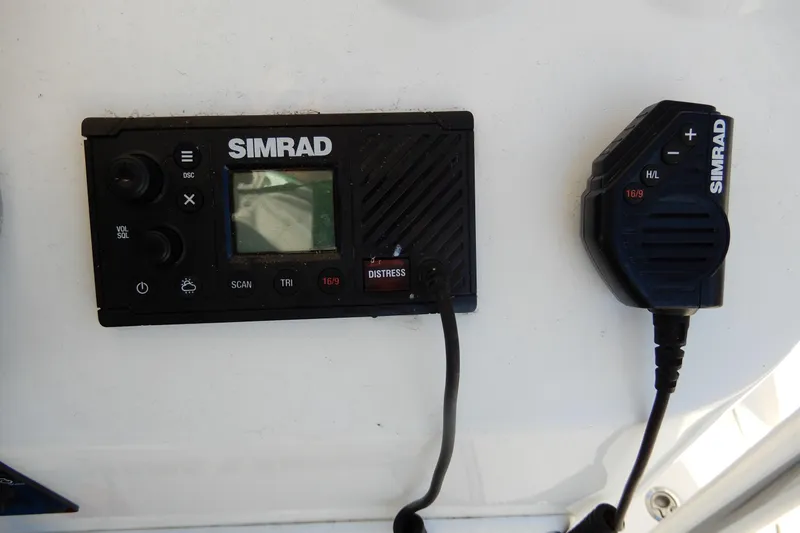Slide: The Image of Simrad marine radio system on 2022 Twin Vee 240 CC GFX Limited Edition boat. - 22