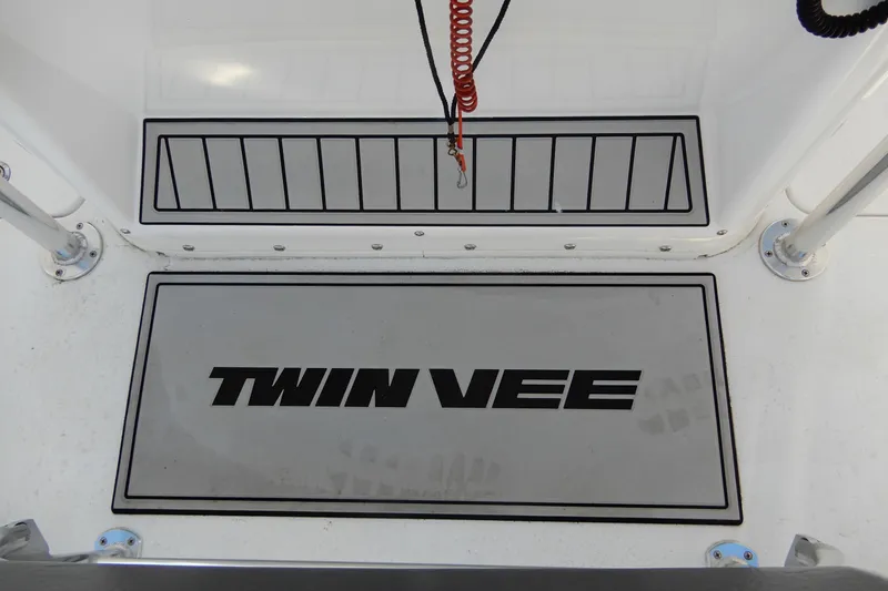 Slide: The Image of 2022 Twin Vee 240 CC GFX Limited Edition boat deck with logo and safety cord. - 26