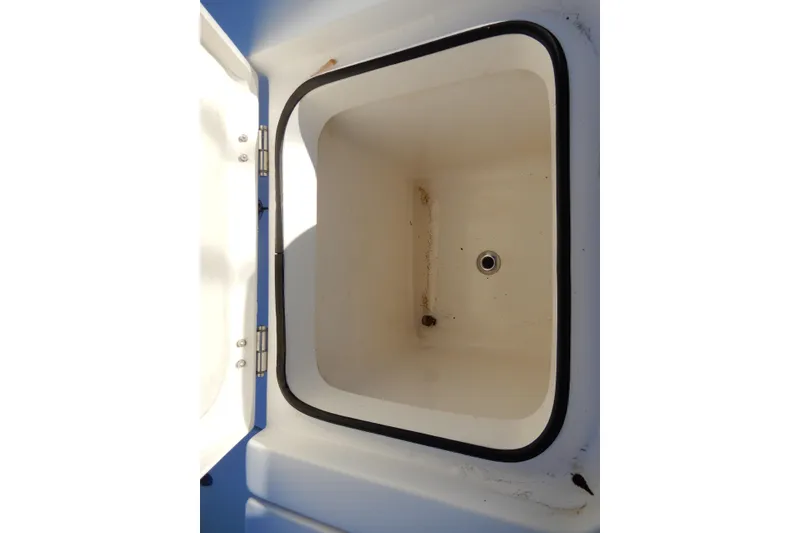 Slide: The Image of Open storage compartment on 2022 Twin Vee 240 CC GFX Limited Edition boat. - 29