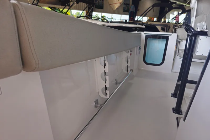 Slide: The Image of 2025 Sportsman Open 232 Center Console interior with seating and storage features. - 14