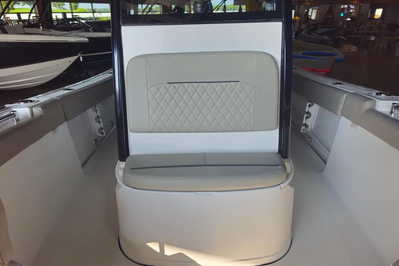 Slide: The Image of 2025 Sportsman Open 232 Center Console boat interior with cushioned seating. - 9