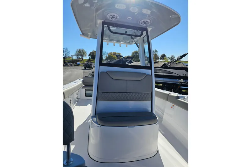 Slide: The Image of 2025 Sportsman Heritage 231 Center Console boat interior with seating and console view. - 15