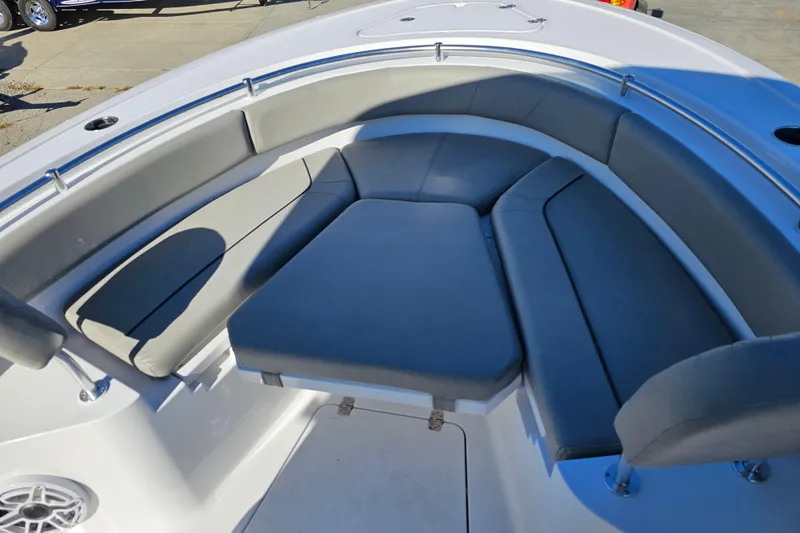 Slide: The Image of 2025 Sportsman Heritage 231 Center Console boat with cushioned seating area. - 19