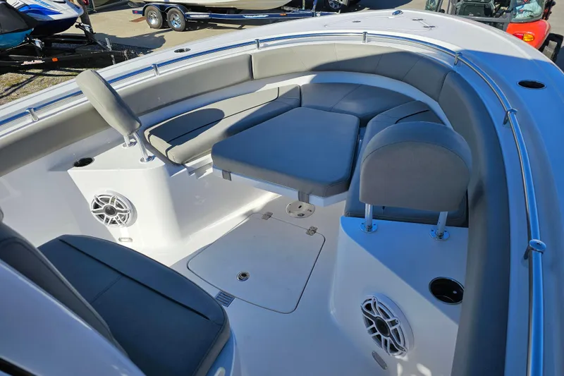 Slide: The Image of 2025 Sportsman Heritage 231 Center Console boat interior with cushioned seating and speakers. - 20
