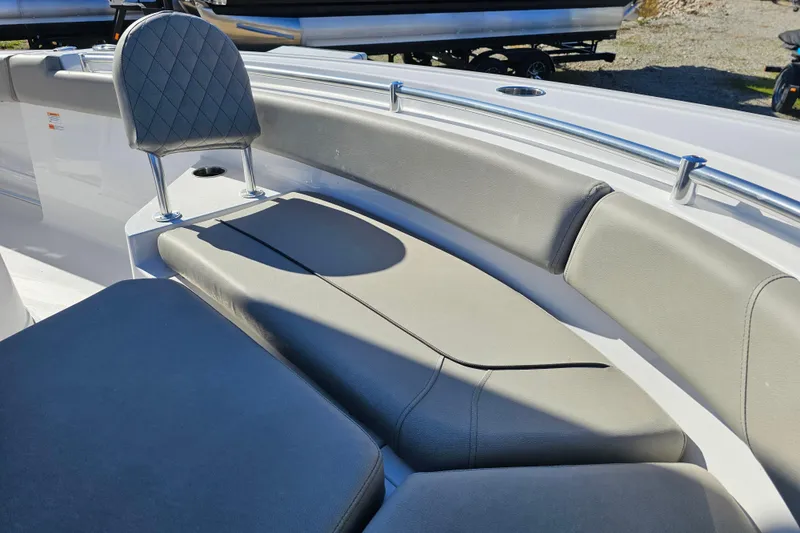 Slide: The Image of 2025 Sportsman Heritage 231 Center Console boat interior with cushioned seating and backrest. - 21