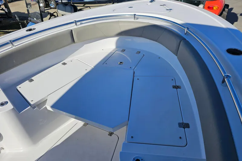 Slide: The Image of 2025 Sportsman Heritage 231 Center Console boat with spacious seating and storage compartments. - 26