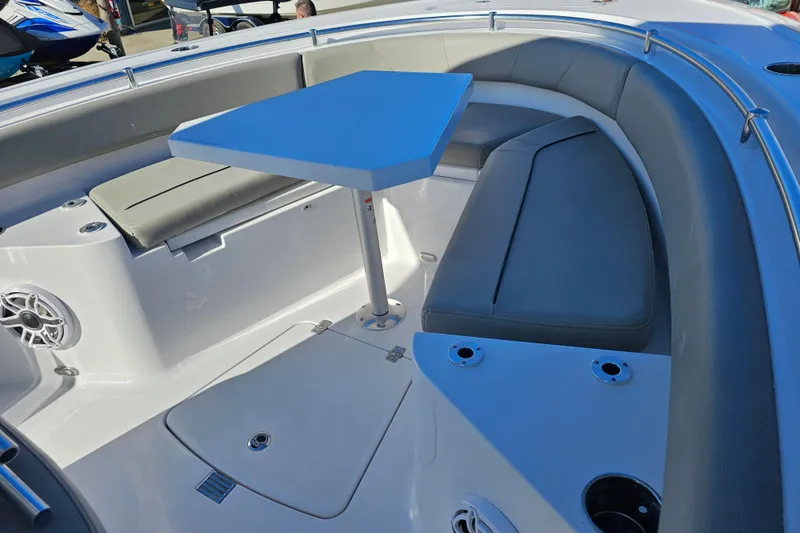Slide: The Image of 2025 Sportsman Heritage 231 Center Console boat interior with seating and table. - 27