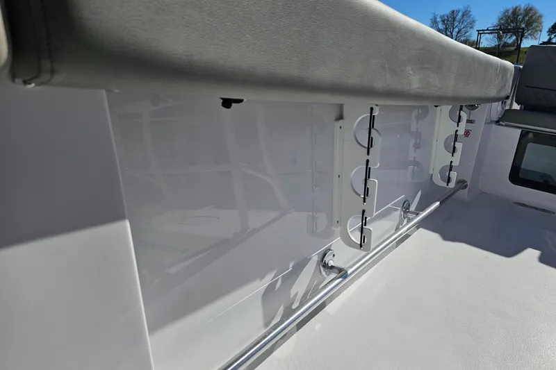 Slide: The Image of 2025 Sportsman Heritage 231 Center Console boat interior with rod holders and seating. - 29