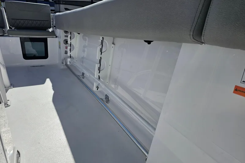 Slide: The Image of 2025 Sportsman Heritage 231 Center Console interior with seating and storage features. - 30