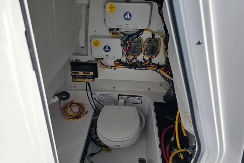 Slide: The Image of 2025 Sportsman Heritage 231 Center Console boat interior wiring and equipment setup. - 32