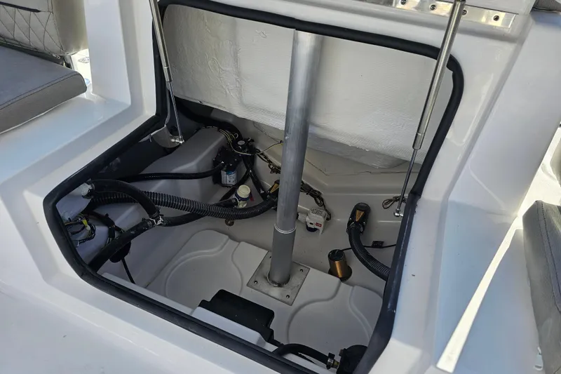 Slide: The Image of 2025 Sportsman Heritage 231 Center Console interior wiring and components view. - 33