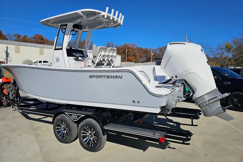 Slide: The Image of 2025 Sportsman Heritage 231 Center Console boat on trailer, featuring sleek design and powerful engine. - 6