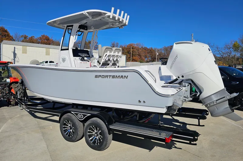 Slide: The Image of 2025 Sportsman Heritage 231 Center Console boat on trailer, featuring a sleek design and powerful engine. - 7