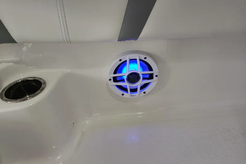 Slide: The Image of 2024 Robalo 246 Cayman boat speaker with blue LED light and cup holder. - 9