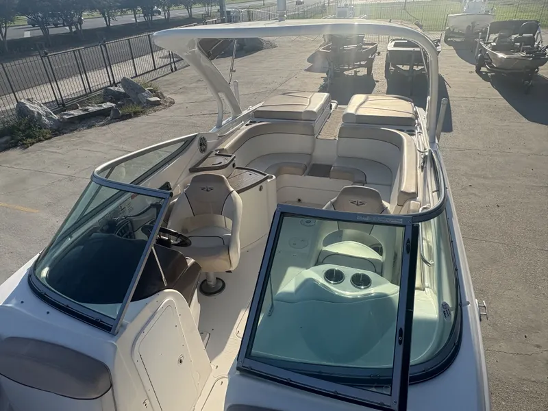 Slide: The Image of 2013 Rinker Captiva 276 boat with spacious seating and sleek design. - 8