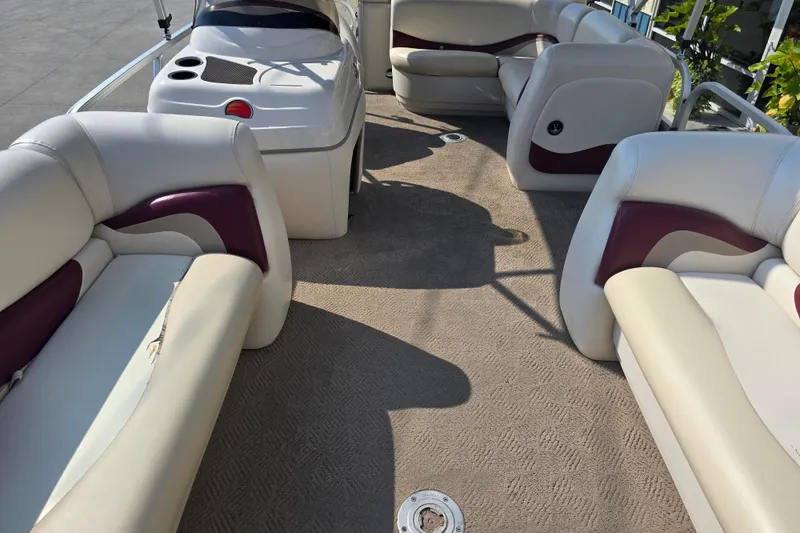 Slide: The Image of 2011 Sun Tracker Party Barge 21 Signature Series interior with plush seating and carpeted floor. - 10