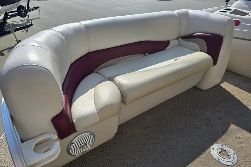 Slide: The Image of 2011 Sun Tracker Party Barge 21 Signature Series boat seating with cup holder and speaker. - 11