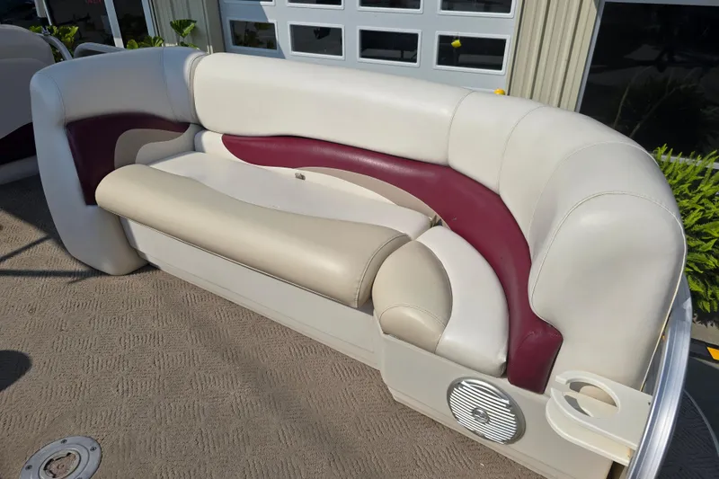 Slide: The Image of 2011 Sun Tracker Party Barge 21 Signature Series boat seating with cup holder and speaker. - 12