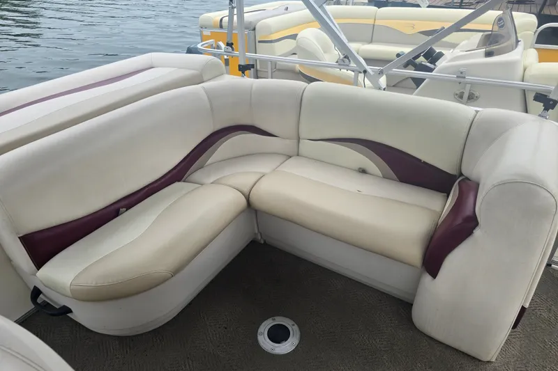 Slide: The Image of 2011 Sun Tracker Party Barge 21 Signature Series interior with cream and maroon seating. - 14