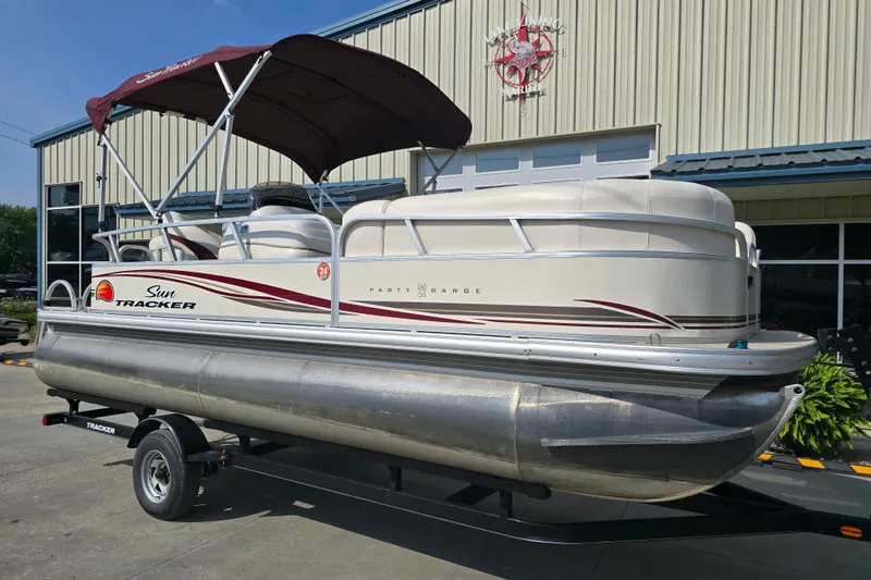 Slide: The Image of 2011 Sun Tracker Party Barge 21 Signature Series pontoon boat with canopy on trailer. - 7