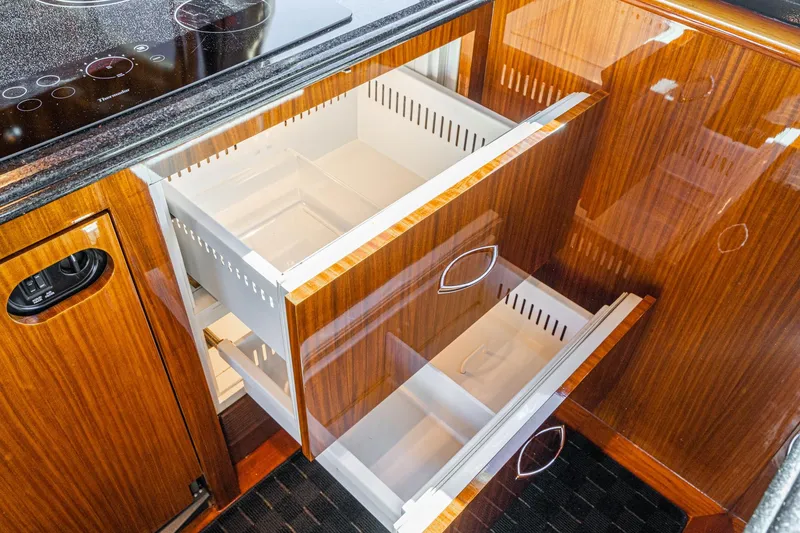 Slide: The Image of Luxurious interior of 1991 Hatteras 58 Convertible yacht with leather seating and waterfront view. - 14