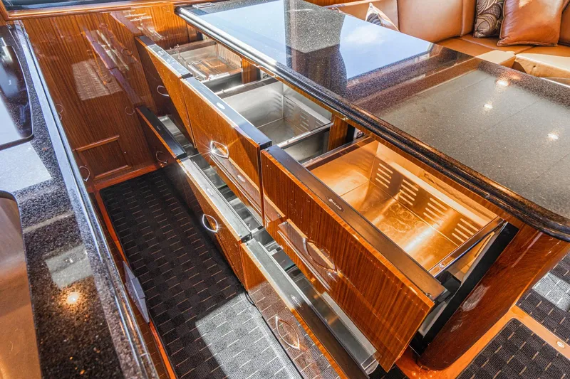 Slide: The Image of Luxurious 1991 Hatteras 58 Convertible yacht interior with polished wood and modern amenities. - 18