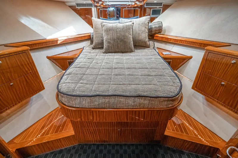 Slide: The Image of Luxurious interior of 1991 Hatteras 58 Convertible yacht with polished wood finishes. - 19