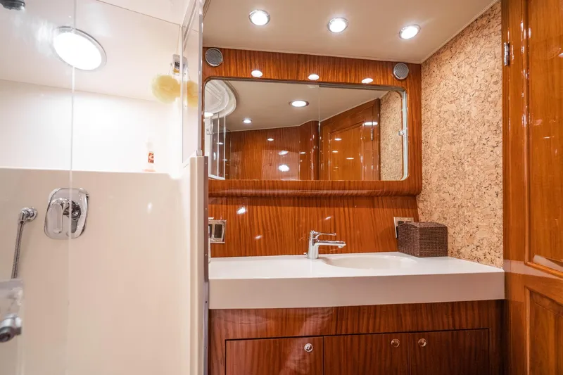 Slide: The Image of Luxurious interior of 1991 Hatteras 58 Convertible yacht with elegant dining area. - 21