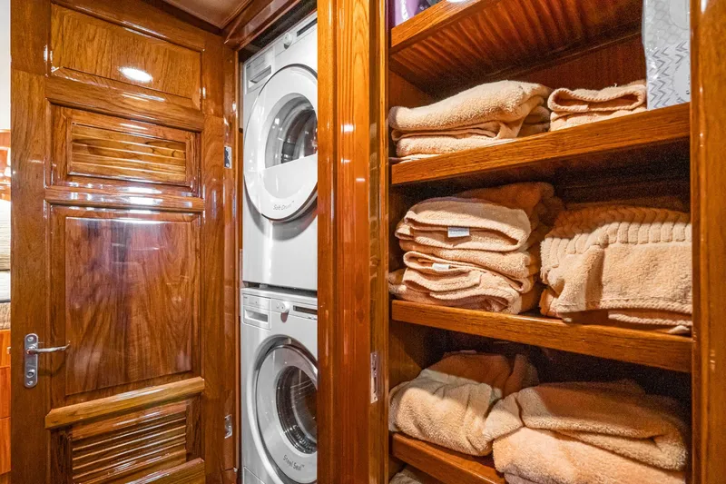 Slide: The Image of Luxurious interior of 1991 Hatteras 58 Convertible yacht with modern kitchen and seating area. - 23