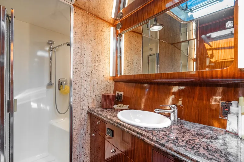 Slide: The Image of Kitchen storage on 1991 Hatteras 58 Convertible yacht with cookware and appliances. - 25