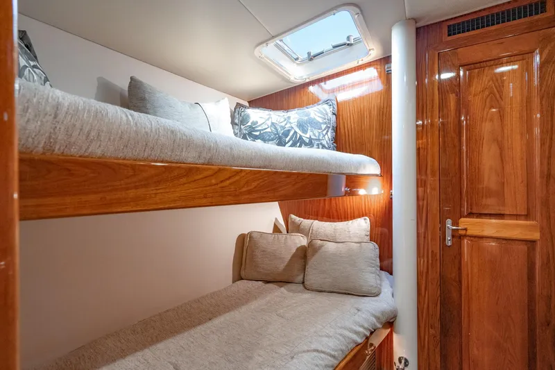 Slide: The Image of Luxurious kitchen drawers in 1991 Hatteras 58 Convertible yacht, featuring sleek wood and granite finishes. - 27