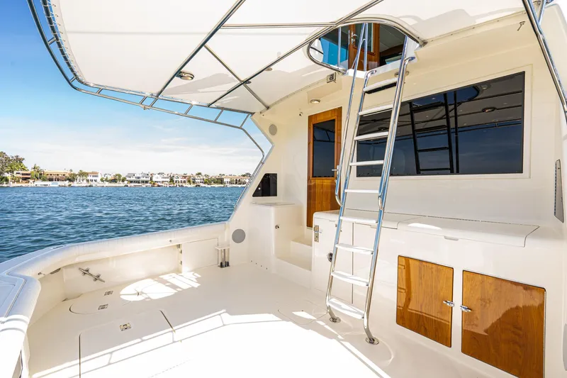 Slide: The Image of Luxurious cabin interior of 1991 Hatteras 58 Convertible yacht with elegant wood finish. - 29