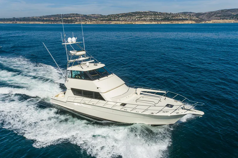 Slide: The Image of 1991 Hatteras 58 Convertible Yacht cruising on open sea. - 3