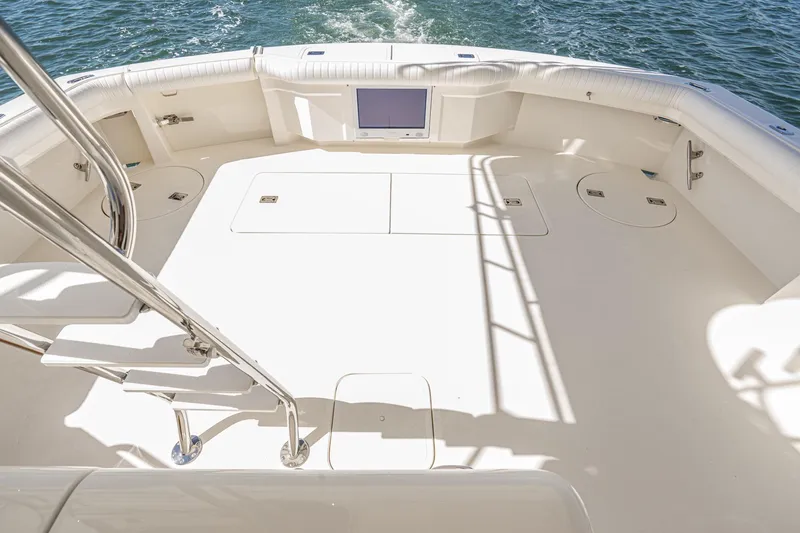 Slide: The Image of Luxurious interior of 1991 Hatteras 58 Convertible yacht with wood paneling and modern amenities. - 34