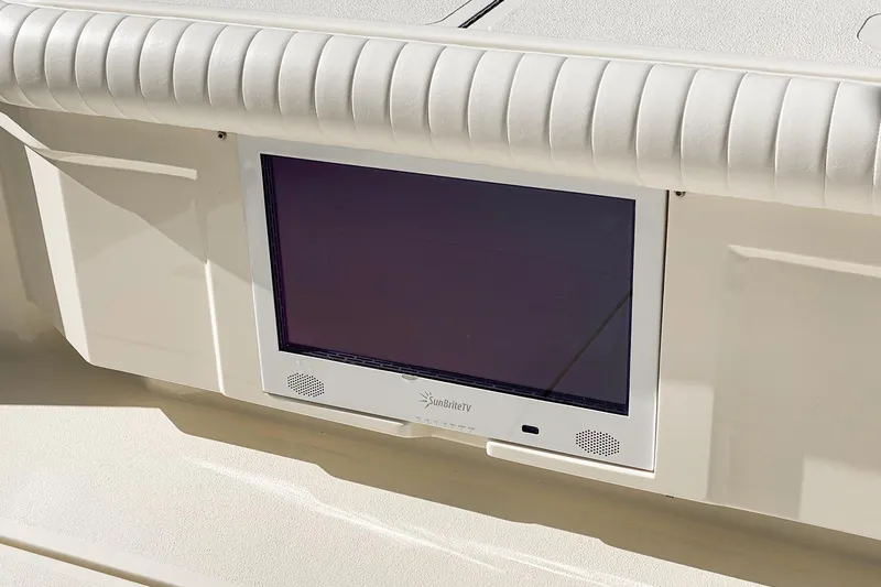 Slide: The Image of Laundry area with stacked washer-dryer and towel storage on 1991 Hatteras 58 Convertible yacht. - 35