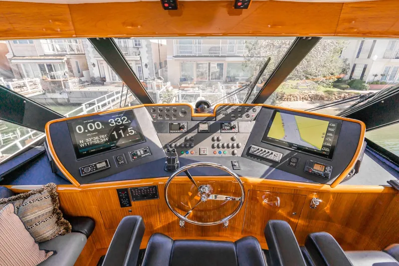 Slide: The Image of 1991 Hatteras 58 Convertible yacht canopy against clear blue sky. - 39