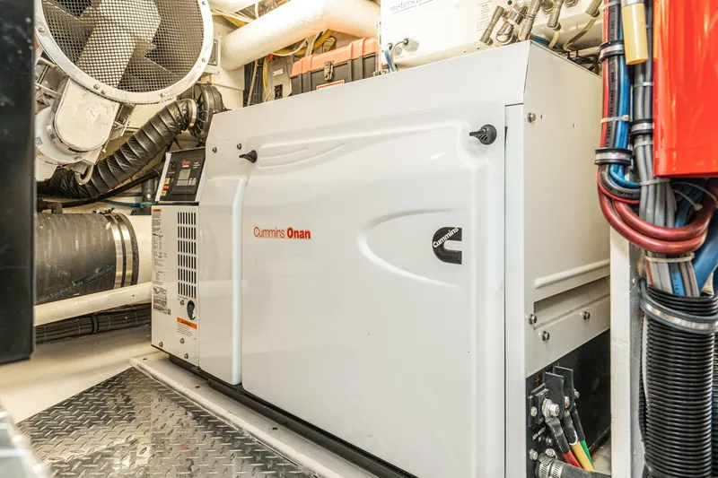 Slide: The Image of Cummins Onan generator in 1991 Hatteras 58 Convertible engine room. - 52