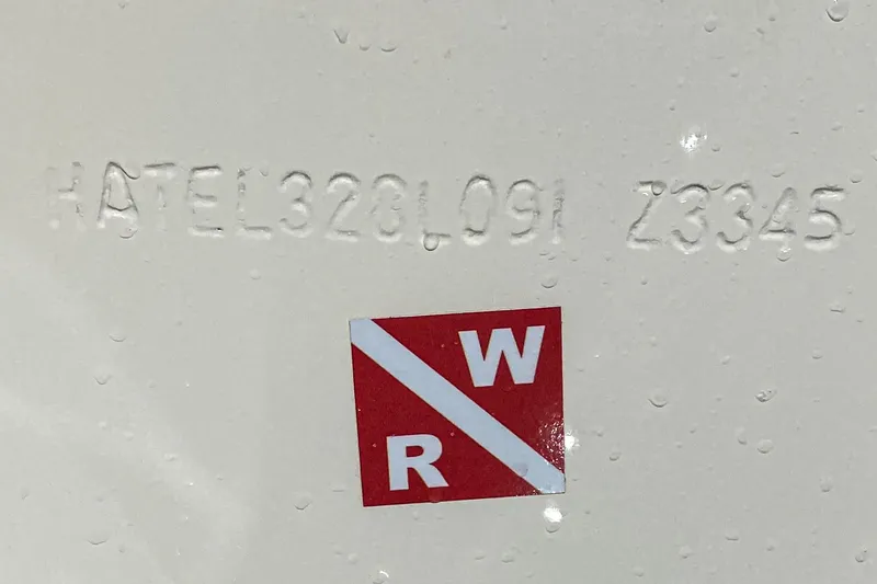 Slide: The Image of Hull identification number on 1991 Hatteras 58 Convertible with red and white sticker. - 53