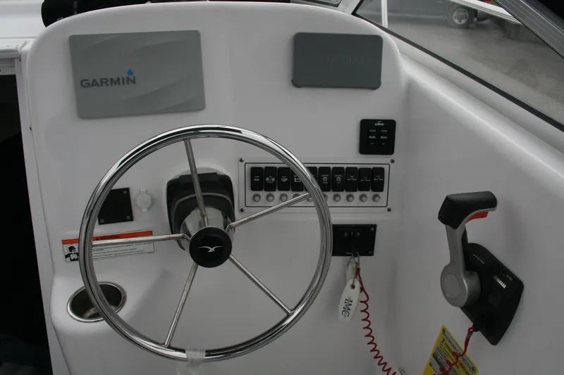 Slide: The Image of 2013 Pro-Line 20 Express boat dashboard with Garmin navigation and Yamaha controls. - 3